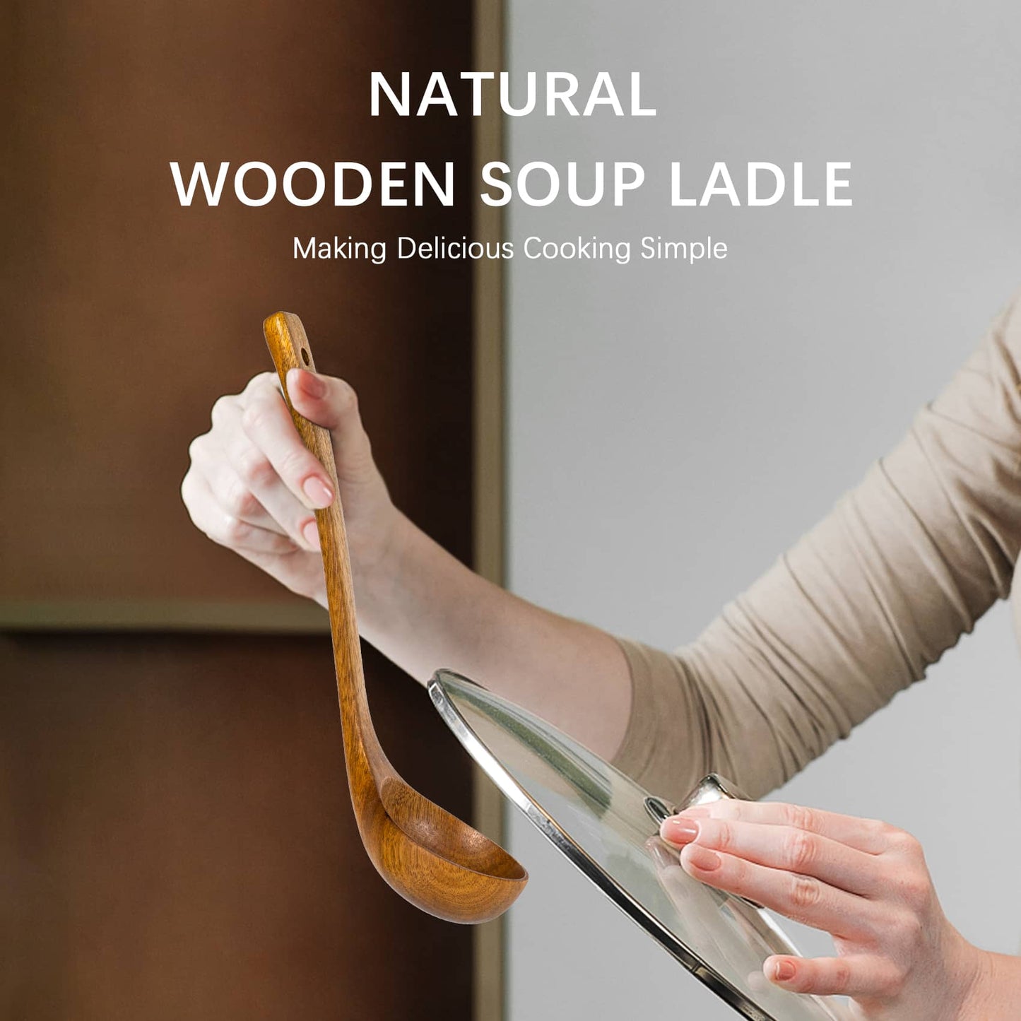 A woman holds in her left hand this smooth polished natural wooden spoon and in her right hand a glass lid.