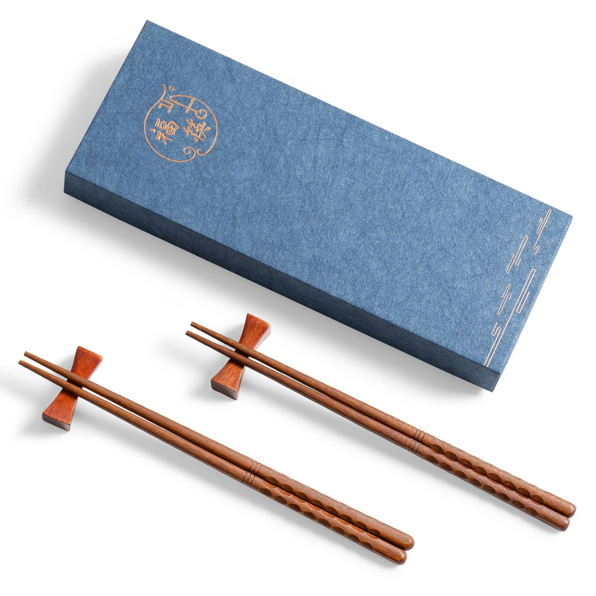 Two pairs of uncoated Chinese wooden chopsticks and two wooden chopstick holders in the shape of dumbbells in a gift box.