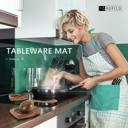 A woman cooking a dish with a spoon rest on the stove top