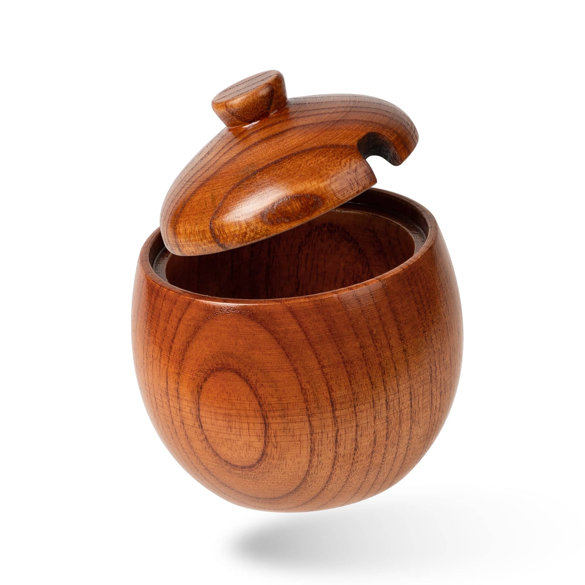 This is a salt shaker made of all natural wood with a lid for better storage and opening and closing